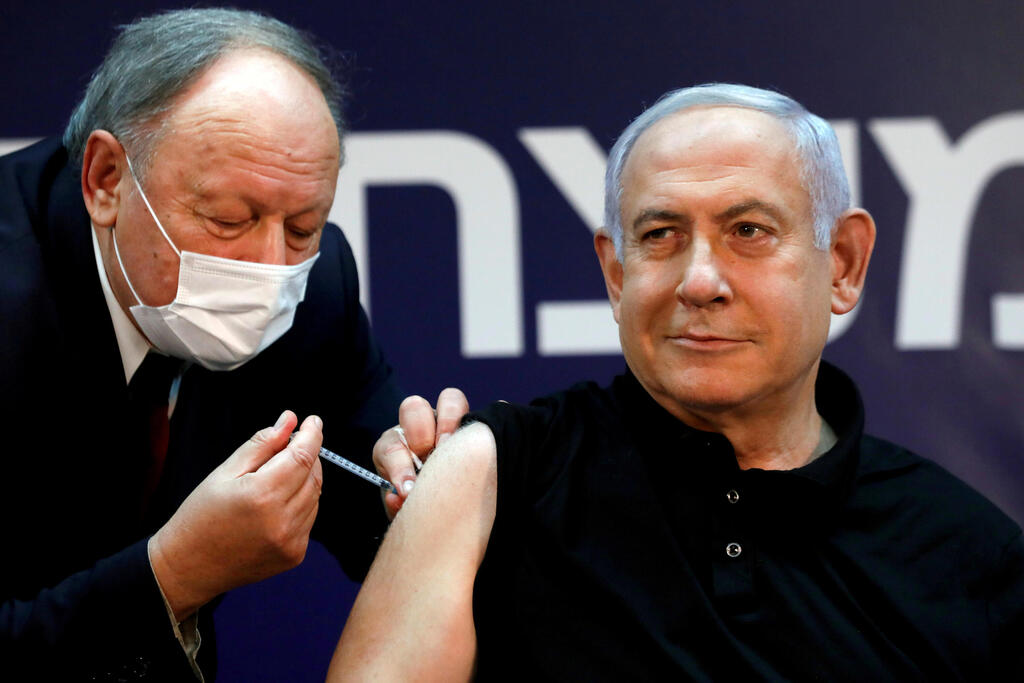 Prime Minister Minister Benjamin Netanyahu receives a coronavirus disease (COVID-19) vaccine at Sheba Medical Center in Ramat Gan 