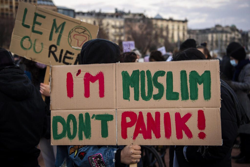People from anti-racist, feminist and ecologist associations and parties demonstrate against the 'anti-burqa' initiative on the Plaine de Plainpalais in Geneva, Switzerland 