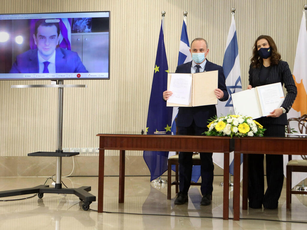 Yuval Steinitz with his Cypriot counterpart Natasa Pilides and Greek Energy Minister Kostas Skrekas on video call, after signing deal linking power grids 