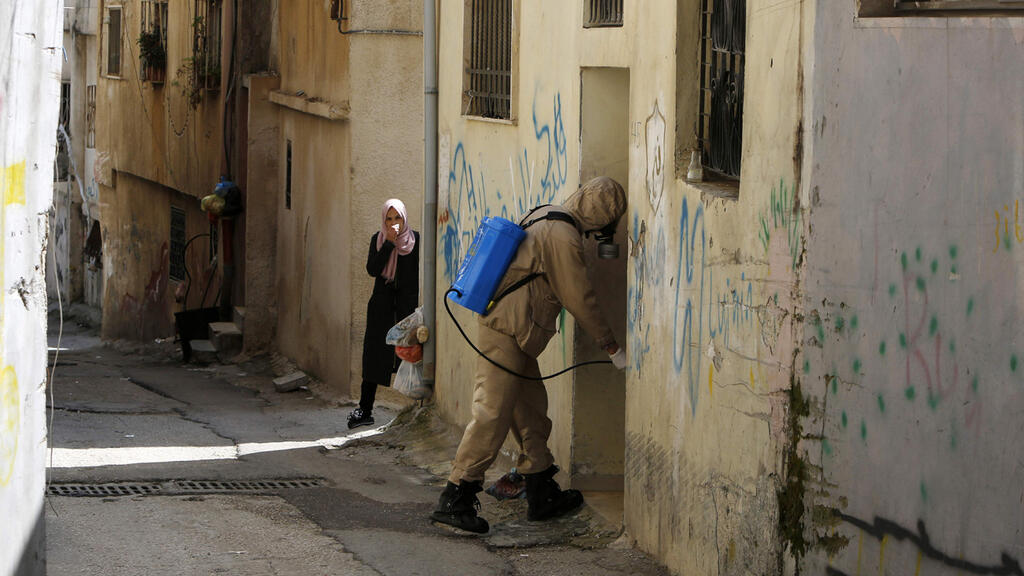 A Bethlehem street is disinfected to prevent the spread of coronavirus 