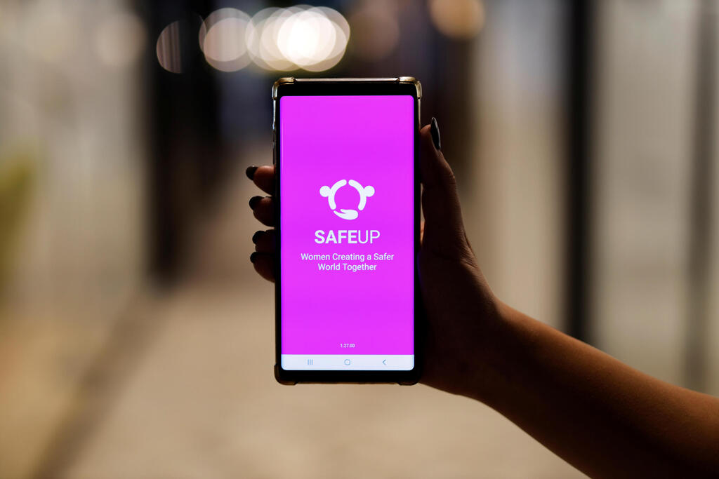 A woman presents the SafeUP, a women's safety net application, at a co-working space in Tel Aviv