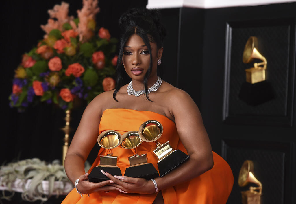 Megan Thee Stallion, winner of the awards for best rap song and best rap performance for "Savage Remix" and best new artist poses in the press room at the 63rd annual Grammy Awards at the Los Angeles Convention Center 