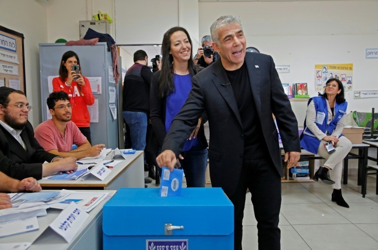 Lapid and his wife Lihi voted at a polling station in Tel Aviv during parliamentary elections in March last year 