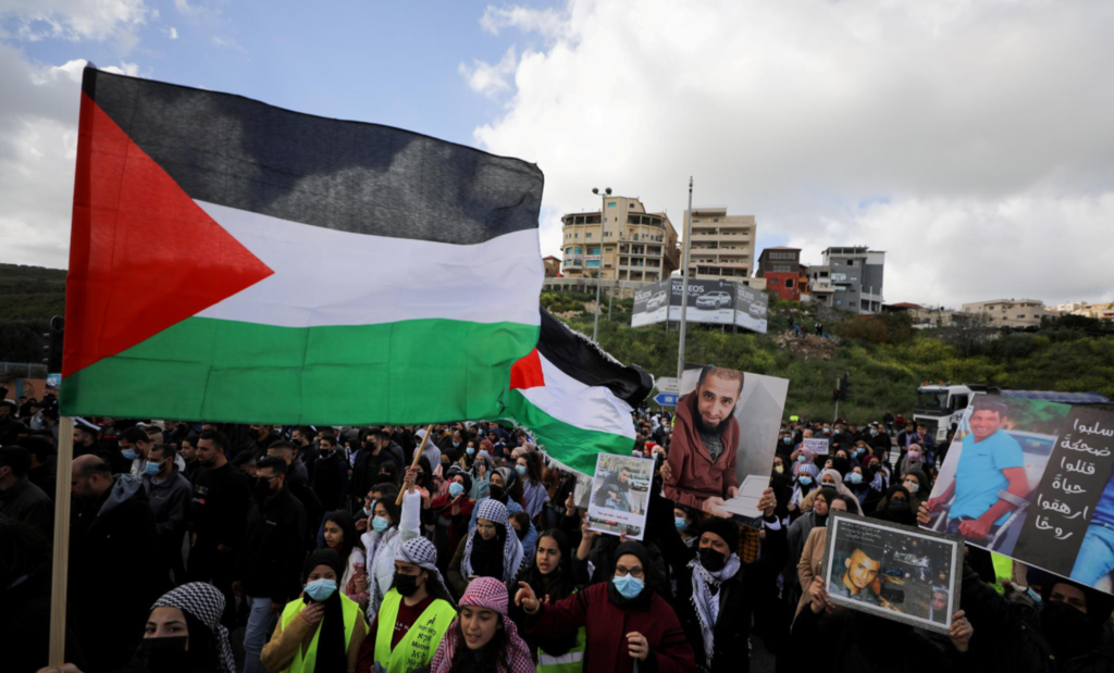 Arab Israelis take part in a protest against a wave of violence in their communities, where they say police have turned a blind eye to crime, in northern town of Umm el Fahm