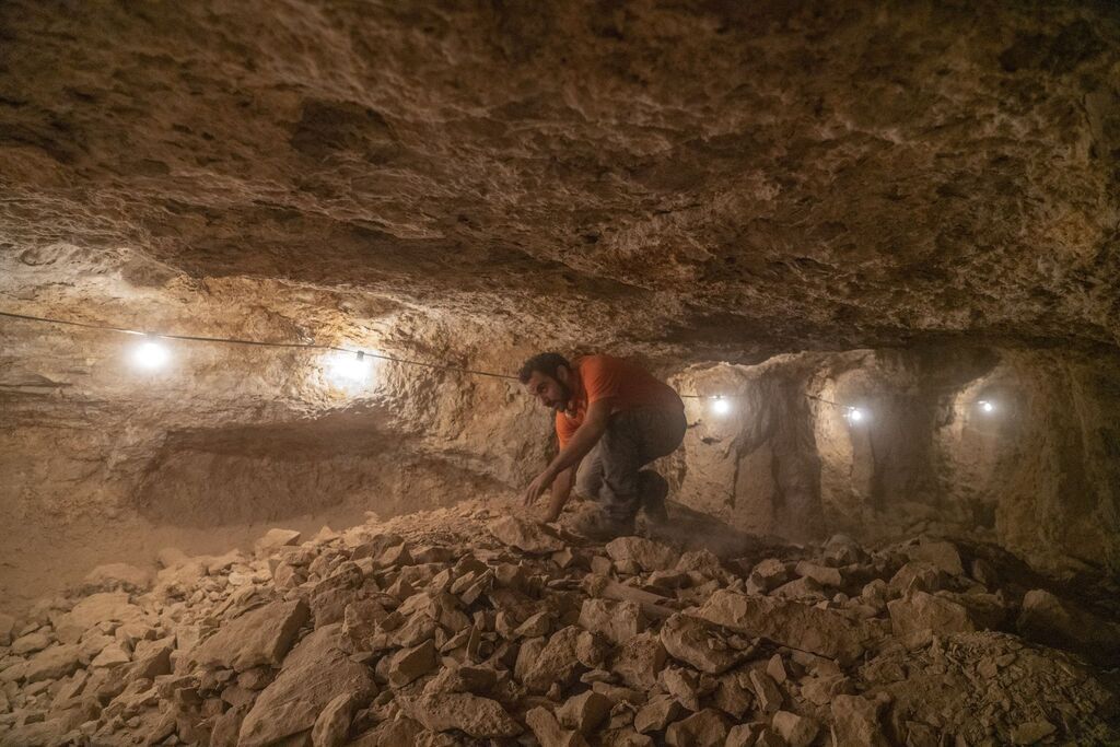 An Archeologist in the Horro cave in the Judean Desert where rare findings were uncovered 
