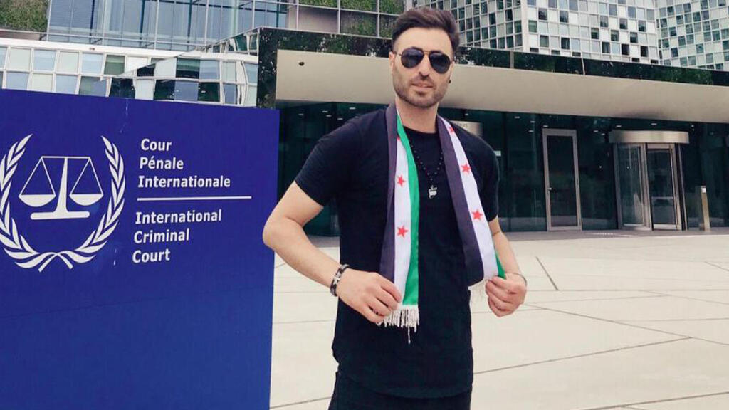 Syrian opposition activist Nedal al-Amari outside the International Criminal Court in The Hague in  2019 