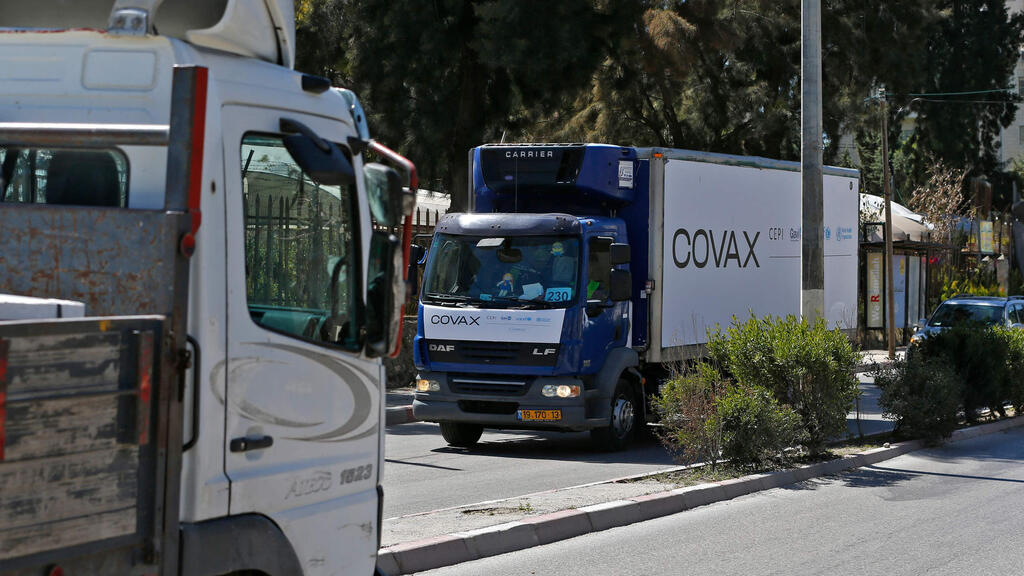 A refrigerated truck loaded with the first delivery of coronavirus vaccine via the United Nations Covax program supporting poorer areas, drives toward the West Bank city of Ramallah, on March 17, 2021 