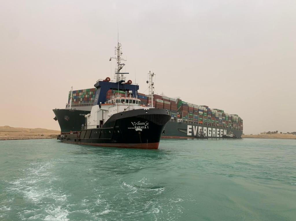 The MV Ever Given container ship hit by strong wind and ran aground in Suez Canal 