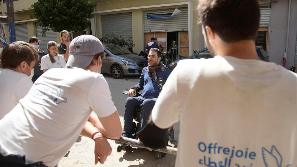 Marc Torbey el Helou, head of Lebanese NGO Offre Joie, talks with volunteers in Beirut, Lebanon 