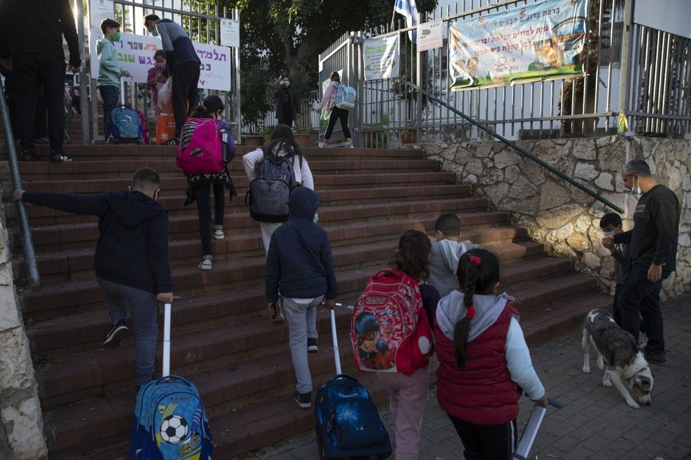 pupils arrive to school in the central Israeli city of Herzliya 