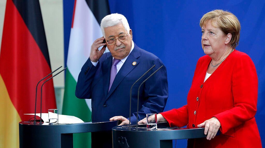Palestinian President Mahmoud Abbas and German Chancellor Angela Merkel speaking following their meeting in Berlin in 2019 