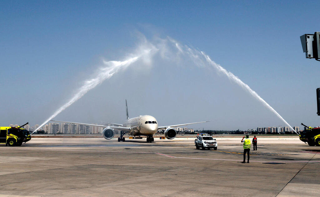 A water salute welcomes an Etihad Airways Boeing 787-9 "Dreamliner" aircraft after landing upon arrival from the United Arab Emirates (UAE) at Israel's Ben Gurion Airport