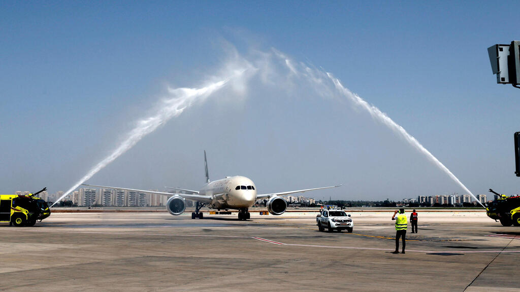 A water salute welcomes an Etihad Airways Boeing 787-9 "Dreamliner" aircraft after landing upon arrival from the United Arab Emirates (UAE) at Israel's Ben Gurion Airport