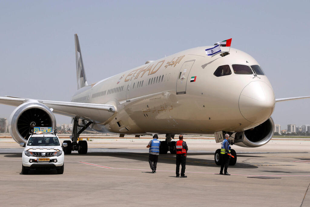 n Etihad Airways Boeing 787-9 "Dreamliner" aircraft displays Israeli and Emirati flags after landing upon arrival from the United Arab Emirates (UAE) at Israel's Ben Gurion Airpor