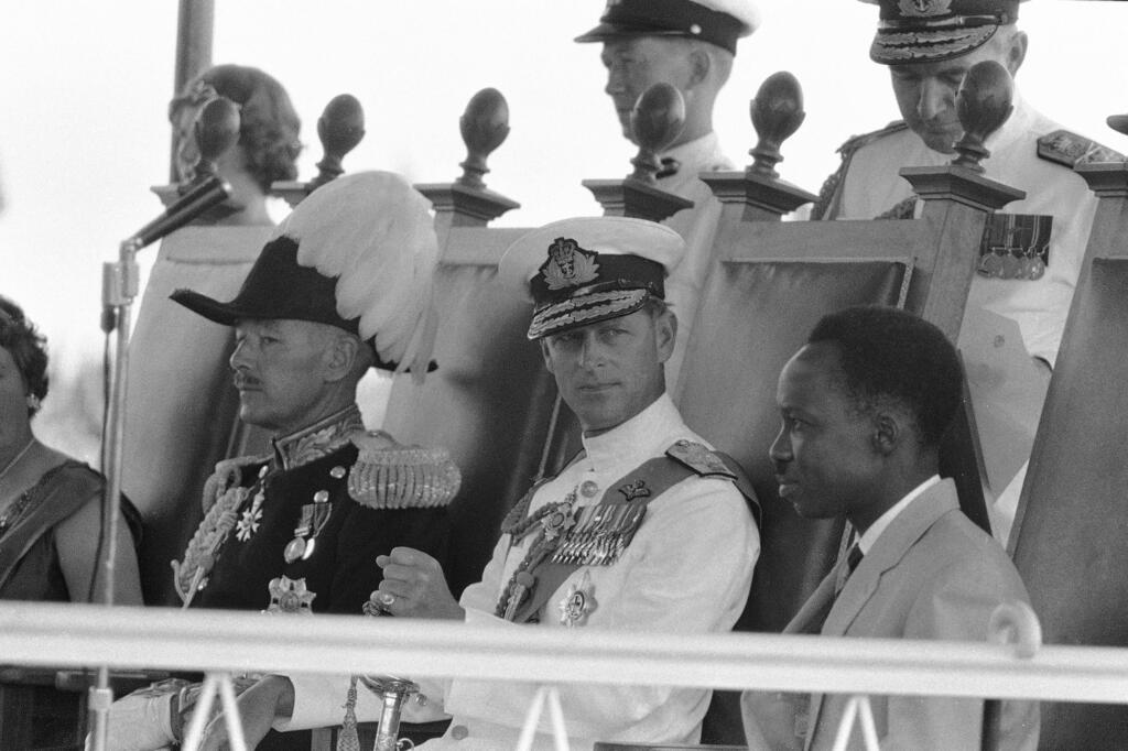 Prince Philip, center, looks at Tanganyika Prime Minister Julius Nyerere, right, during the ceremony to swear in the new Governor-General, at the Independence celebrations, in Dar-Es-Salaam, Tanganyika, Dec. 9, 1961 