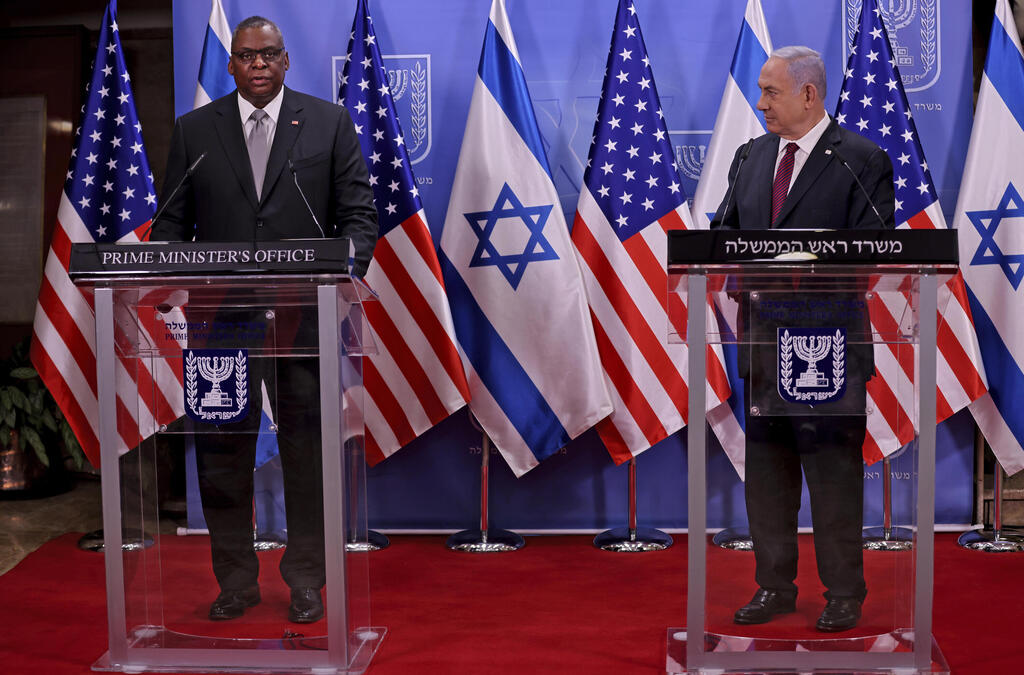 U.S. Defense Secretary Lloyd Austin, left, and Israeli Prime Minister Benjamin Netanyahu give statements after their meeting, at the prime minister's office, in Jerusalem 