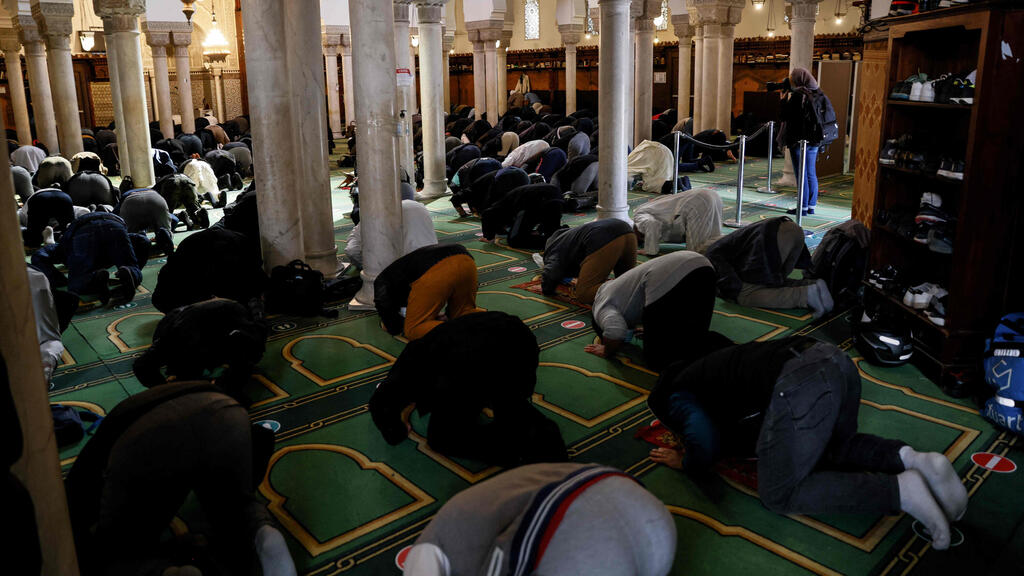 People pray at the Grand Mosquee de Paris on April 13, 2021 hours before the start of the Muslim holy month of Ramadan in France.