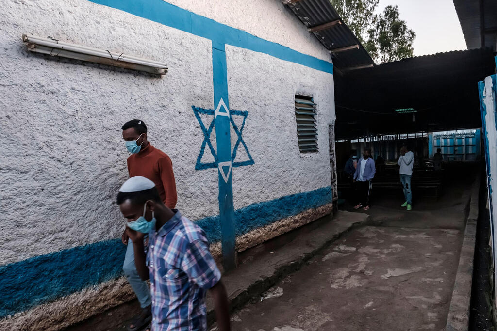 Members of the Ethiopian Jewish community leave the building after attending a religious service at the synagogue of the community in the city of Gondar, Ethiopia 