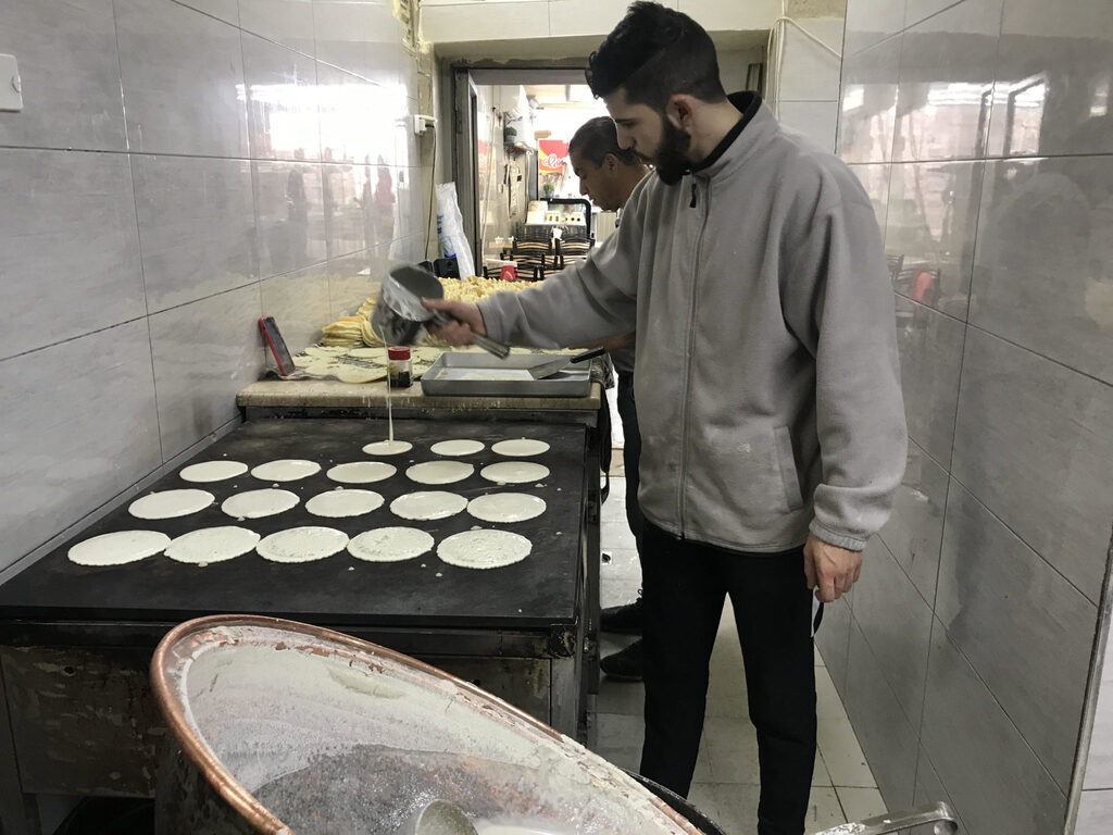 Noor Abu Sbaih makes qatayef at Al-Najah Sweets in Jerusalem’s Old City 