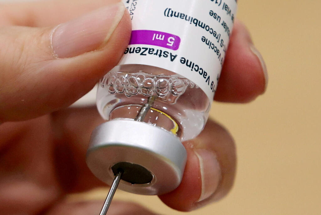 A medical worker prepares a dose of Oxford/AstraZeneca's COVID-19 vaccine at a vaccination centre in Antwerp, Belgium 