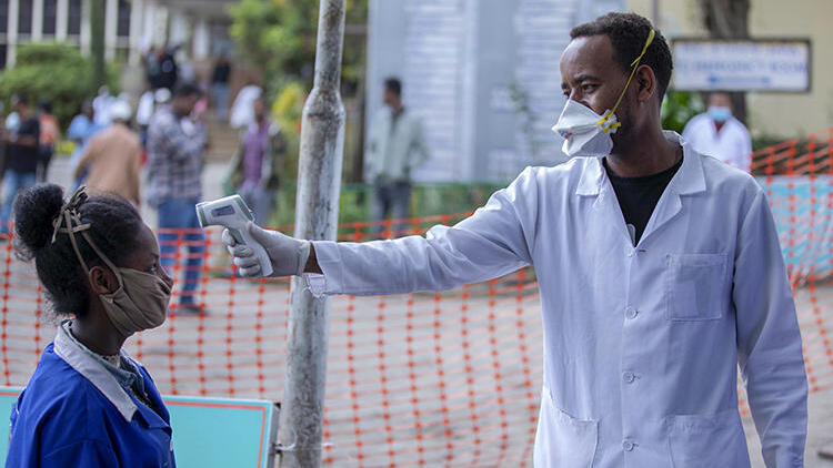  People have their temperatures checked at the Zewditu Memorial Hospital in Addis Ababa, Ethiopia,