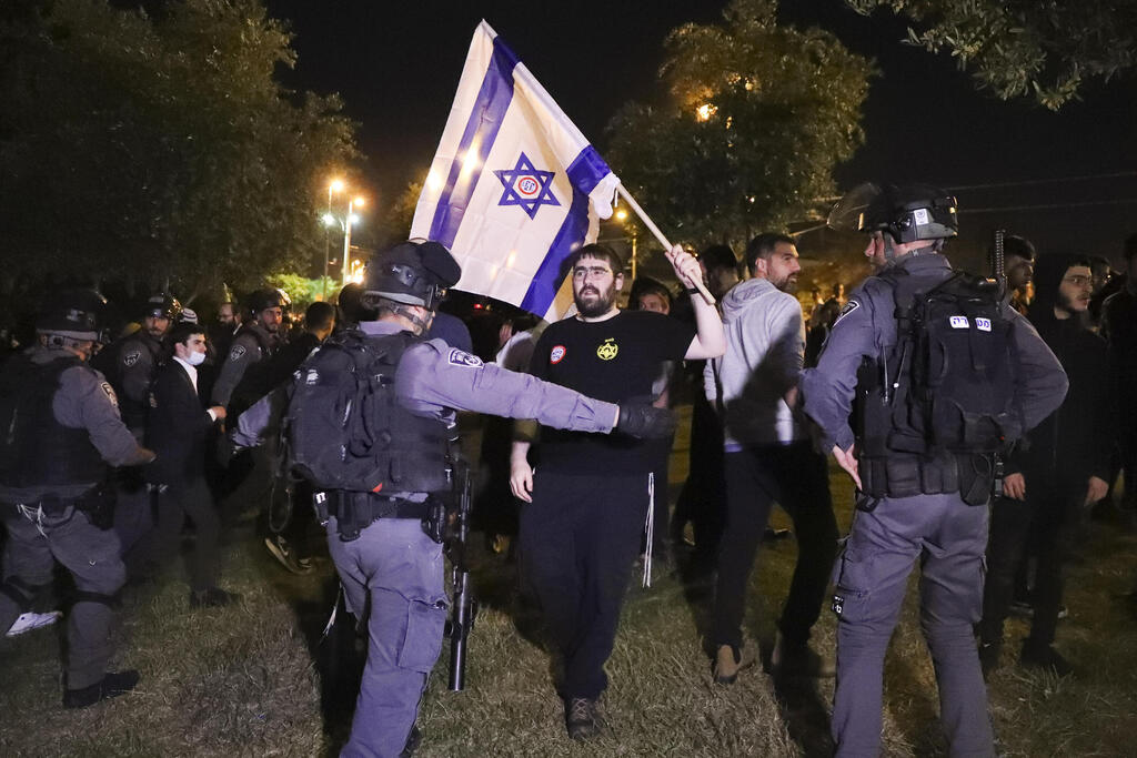 Border Police block members of the Jewish extremist Lehava group from marching to Damascus Gate in Jerusalem on Thursday 