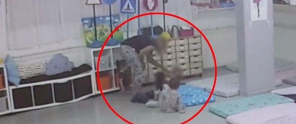 video footage shoeing one of hte kindergarten staffers slapping a toddler