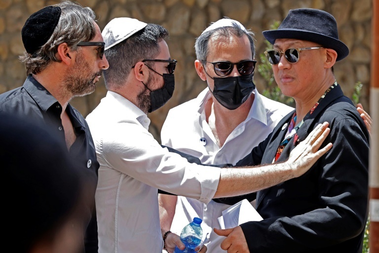 Alber Elbaz's relatives with his long-term partner at his funeral in Holon on Wednesday  