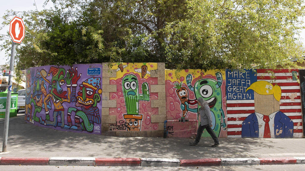 Graffiti adorns a wall in the Jaffa neighborhood of Tel Aviv, Israel, Wednesday, April 21, 2021 