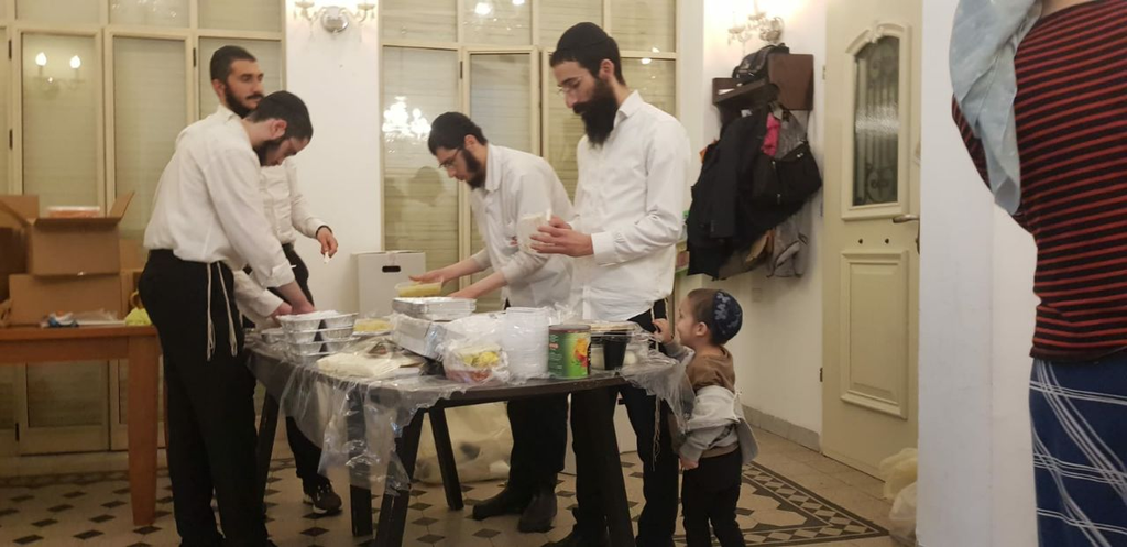 Lev Chabad members preparing food for those caught up in the disaster  