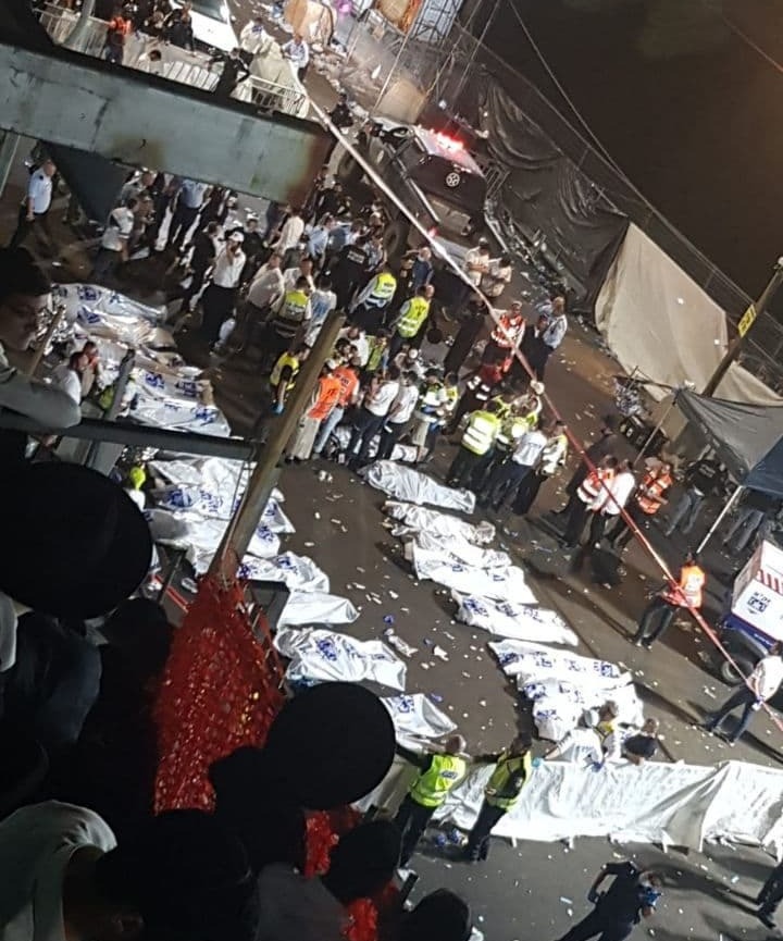Dozens of body bags lying on the ground shortly after the tragic event