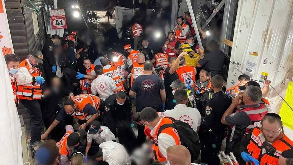Rescue workers from the United Hatzalah volunteer service trying to treat the injured during the Meron disaster 