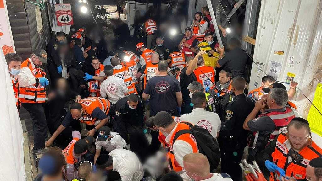 Rescue workers from the United Hatzalah volunteer service trying to treat the injured during the Meron disaster 
