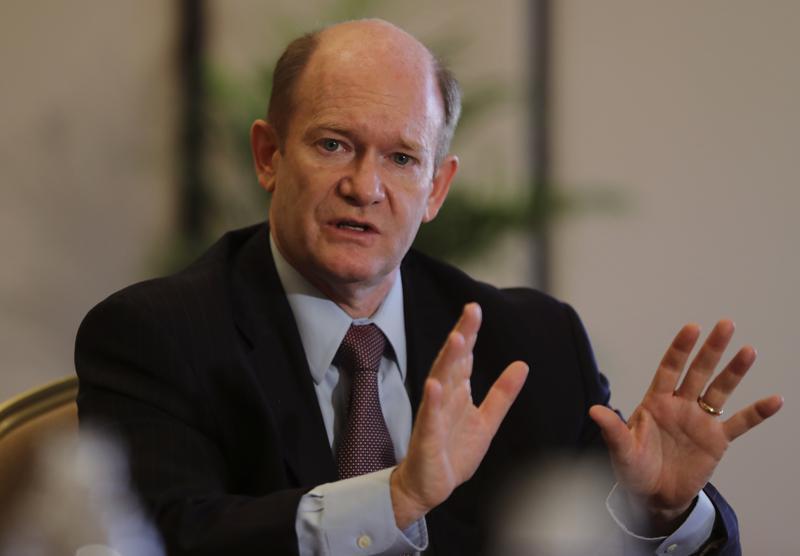 Senator Chris Coons of Delaware talks to the journalists during a press briefing in Abu Dhabi, United Arab Emirates 