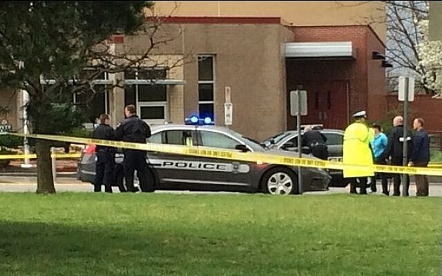 authorities respond to the Jewish community center after a shooting in Overland Park, Kan. 