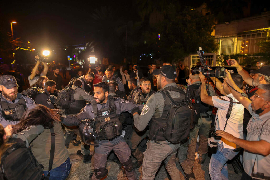 Israeli security forces detain a Palestinian amid ongoing confrontations as Palestinian families face eviction in the Sheikh Jarrah neighborhood 