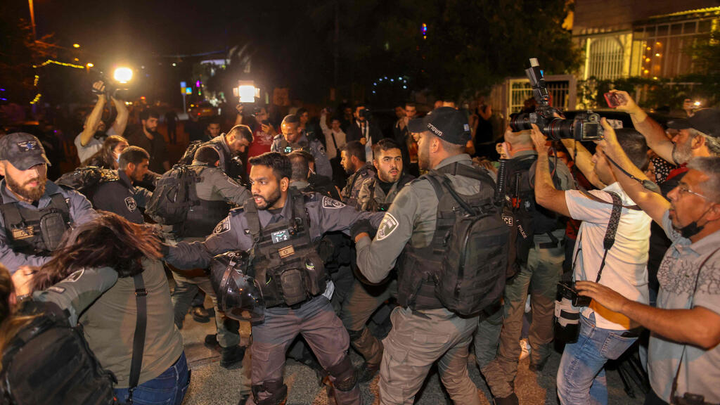 Israeli security forces detain a Palestinian amid ongoing confrontations as Palestinian families face eviction in the Sheikh Jarrah neighborhood 
