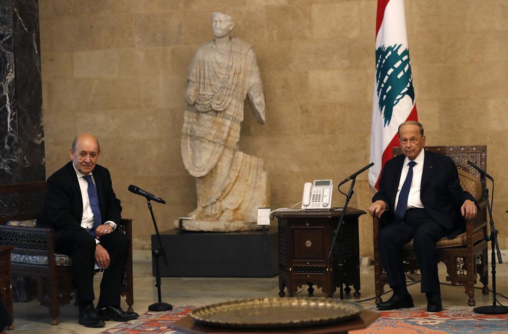 French Foreign Minister Jean-Yves Le Drian, left, meets with Lebanese President Michel Aoun at the Presidential Palace in Baabda, east of Beirut, Lebanon 