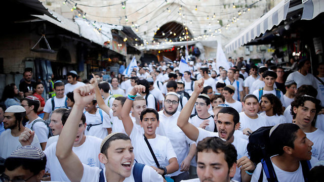 Young right-wing Israelis march through the Old City on Jerusalem Day in 2019 (Photo: Reuters) Right wing youth march through the Old City on Jerusalem Day 2019
