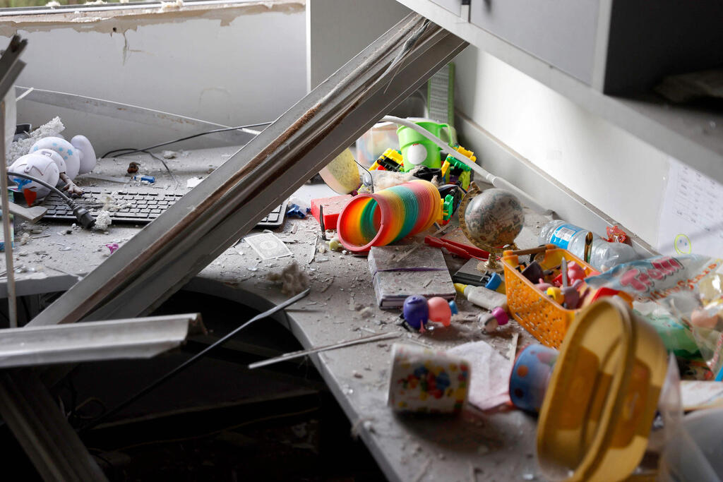 A picture taken early Tuesday shows damage to a bedroom hit by a rocket in Ashkelon 