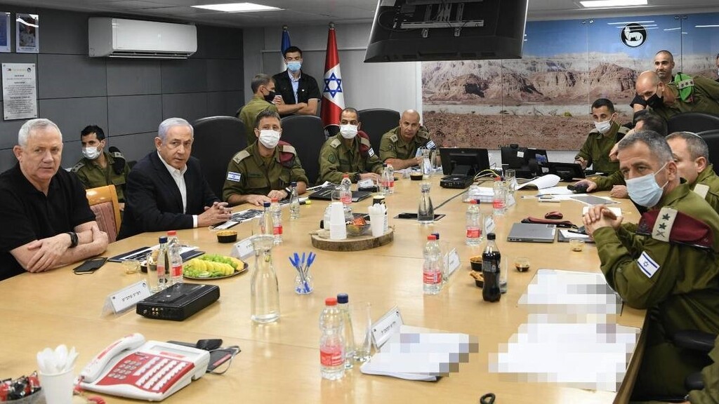 Defense Minister Benny Gantz, Prime Minister Benjamin Netanyahu and IDF Chief of Staff Aviv Kochavi attend a sitaution assessment in southern Israel, May 11, 2021 