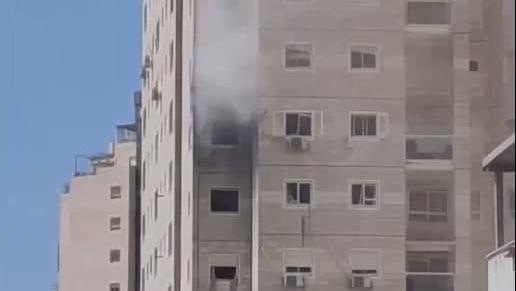 A residential building where one of the victims lived suffers a direct hit 