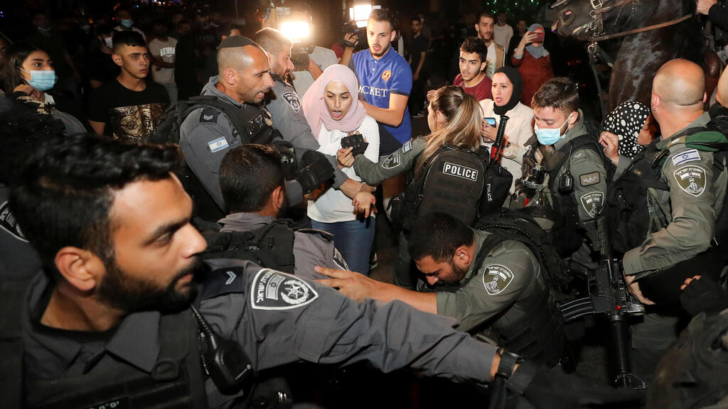A Palestinian resident reacts during scuffles with Israeli police amid ongoing tension ahead of an upcoming court hearing in an Israeli-Palestinian land-ownership dispute in the Sheikh Jarrah neighborhood of East Jerusalem May 4, 2021