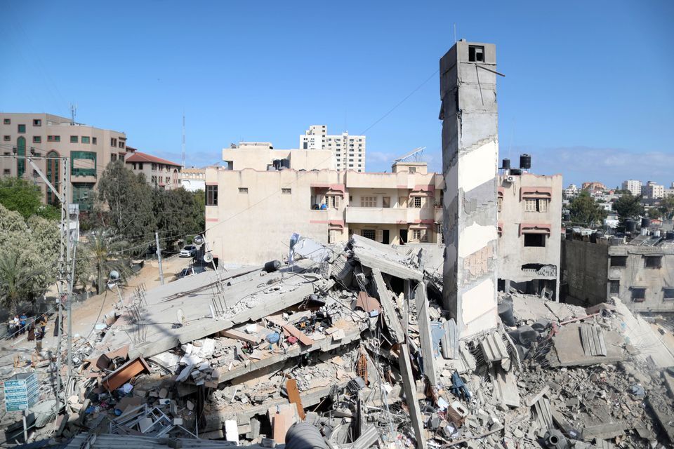 A view shows the remains of a building after it was destroyed in Israeli air strikes, amid a flare-up of Israeli-Palestinian fighting, in Gaza City 