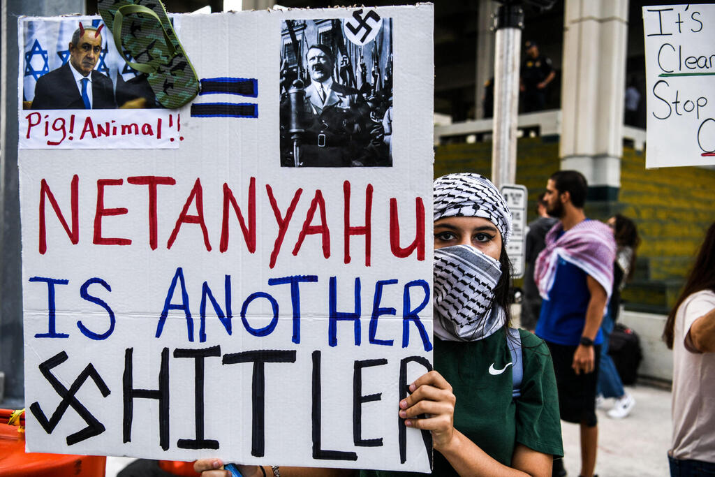 A pro-Palestinian rally in Florida sees a woman holding a sign that reads 'Netanyahu is another Hitler' 