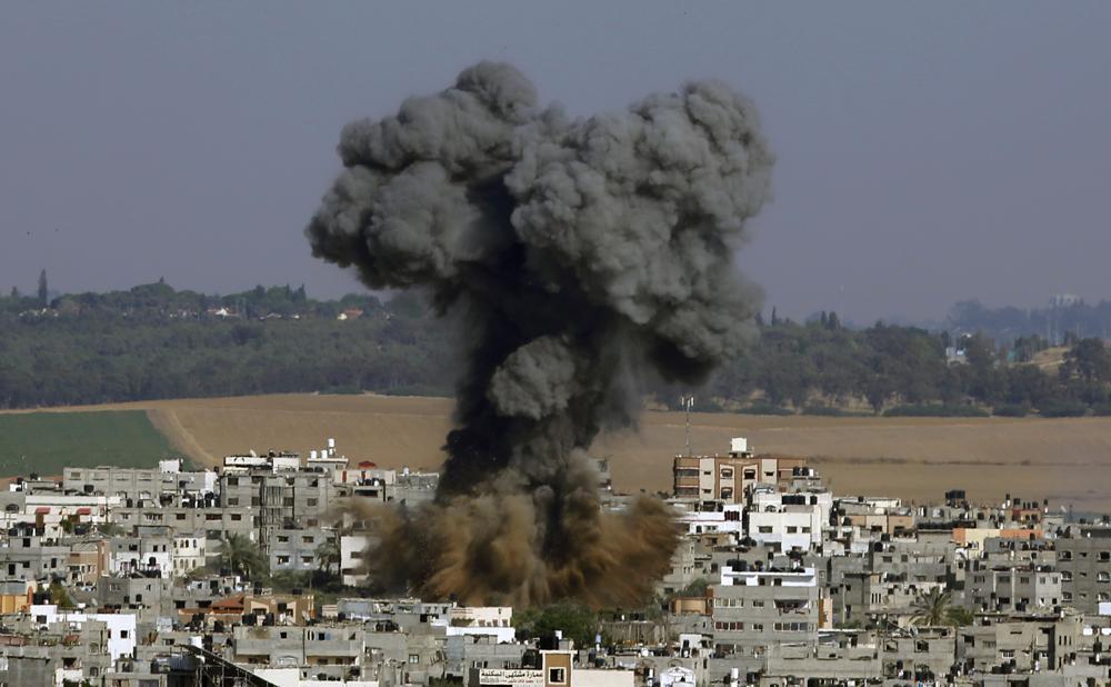 smoke rises after an Israeli airstrike in Gaza City 