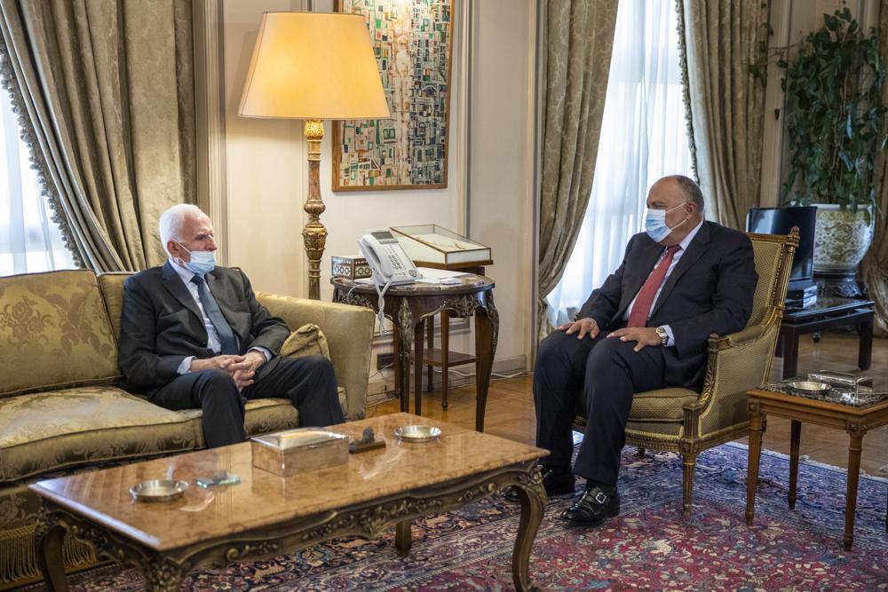 Egyptian Foreign Minister Sameh Shoukry, right, meets with Palestinian Fatah official Azzam Al-Ahmad at the foreign ministry in Cairo 