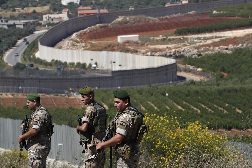 Lebanese army soldiers deploy at the Lebanese side of the Lebanese-Israeli border in the southern village of Kfar Kila, Lebanon 