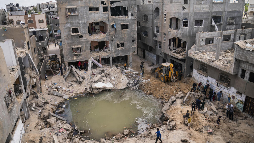 A crater remains where the al Masri home stood before it was destroyed in an Israeli strike onBeit Hanoun in the northern Gaza Strip 