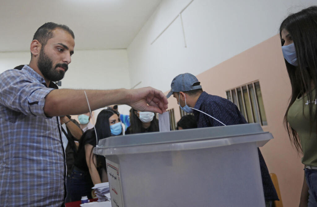 A Syrian man casts his vote during presidential elections in Damascus on Wednesday 